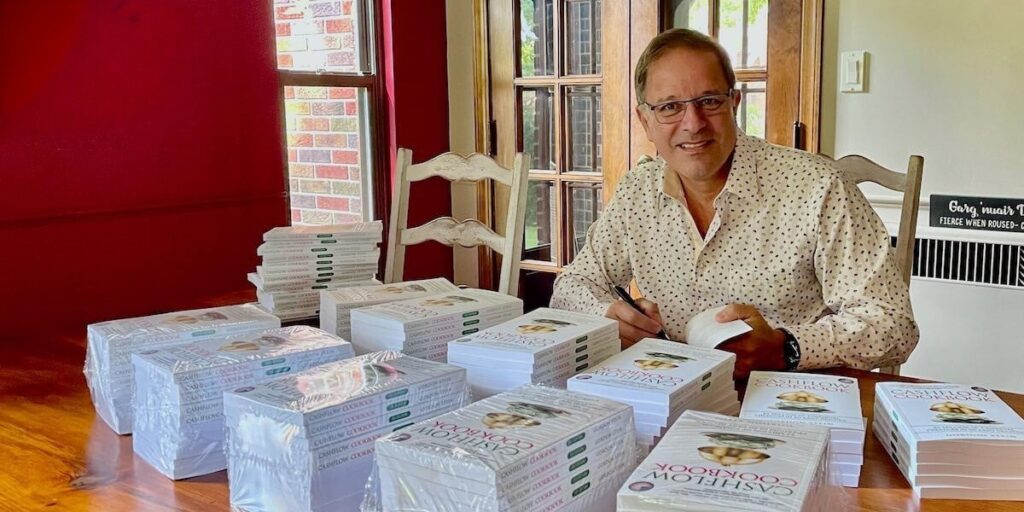 Gordon Stein signing copies of Cashflow Cookbook